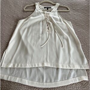 Off white sleeveless blouse by BCBG